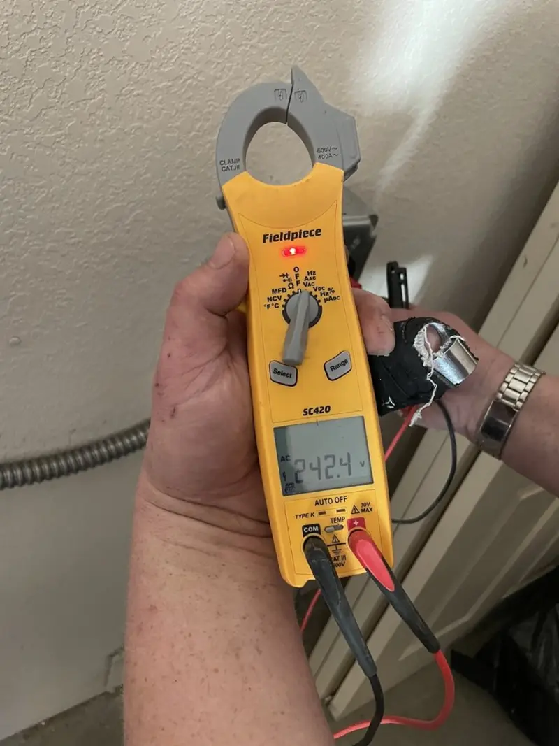 Voltage testing with clamp meter during Whole House Surge Protector in West York